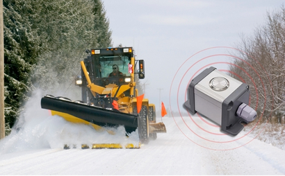 An SOS Man-down alert device with a snow grader on a snowy road