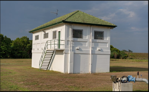 An isolated building in a field